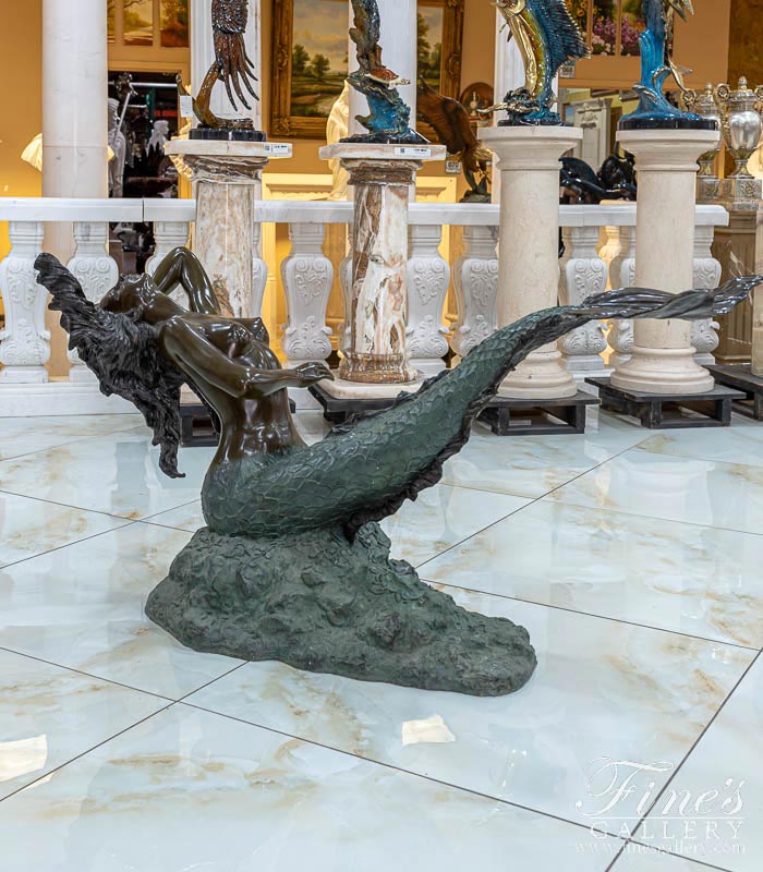 A museum quality, vintage Bronze Mermaid Table