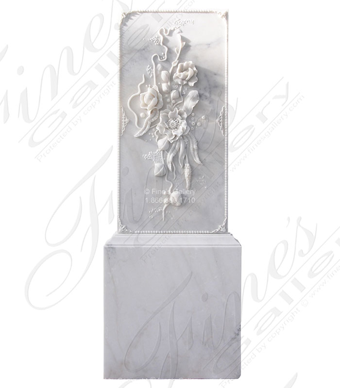 Elaborate carved marble floral scrollwork relief