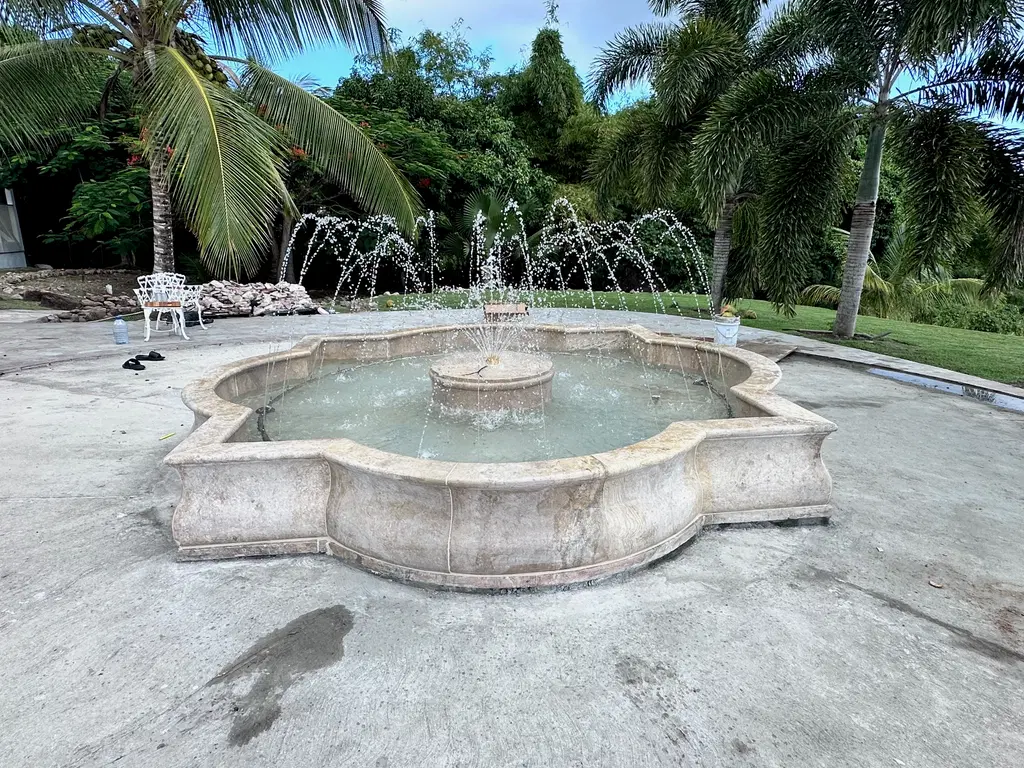 Quatrefoil Catch Basin Fountain Installation In the Carribean