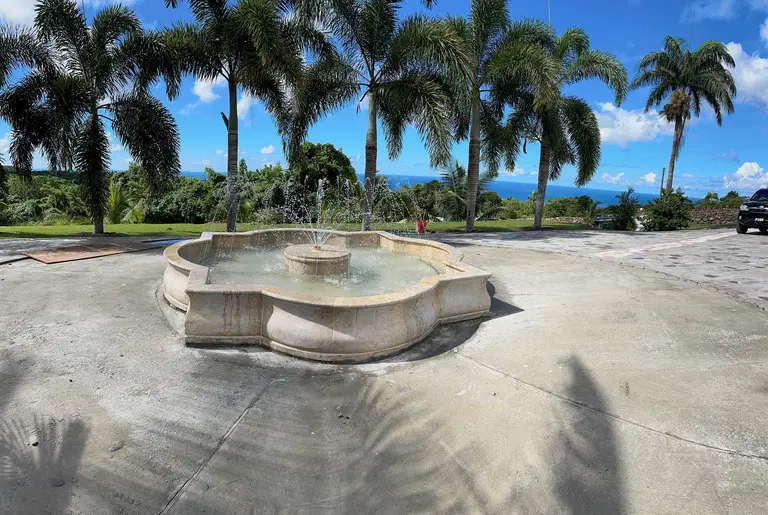Quatrefoil Catch Basin Fountain Installation In the Carribean
