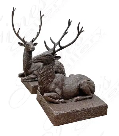 A Pair of Seated Stags in Bronze