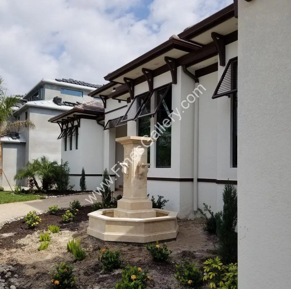 Limestone Fountain Installation at Coastal Home In Florida