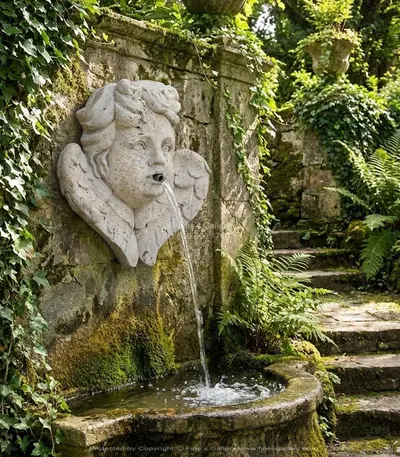 Cherub w/Wings Wall Mount Fountain in Travertine