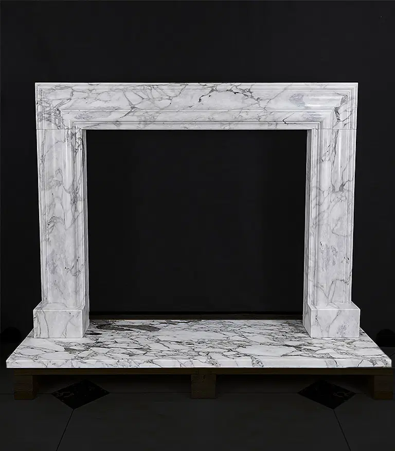 A Bolection Style Mantel in Arabascato Marble