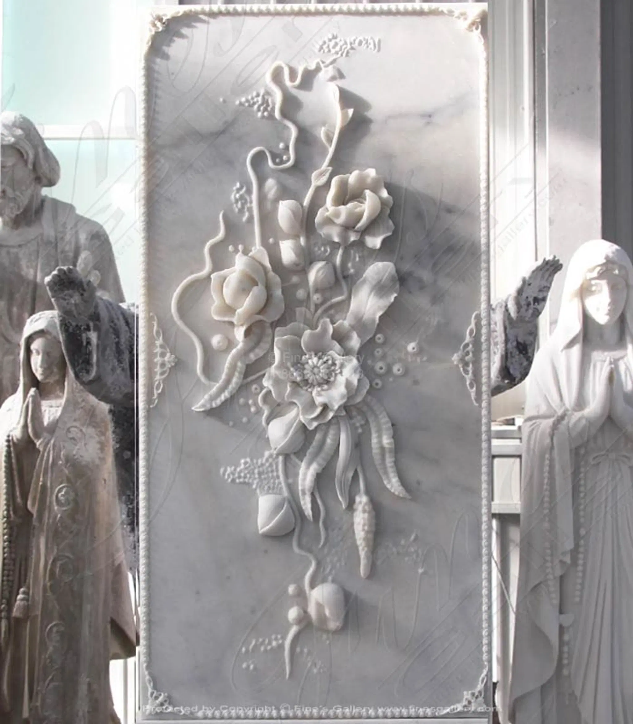 Elaborate carved marble floral scrollwork relief